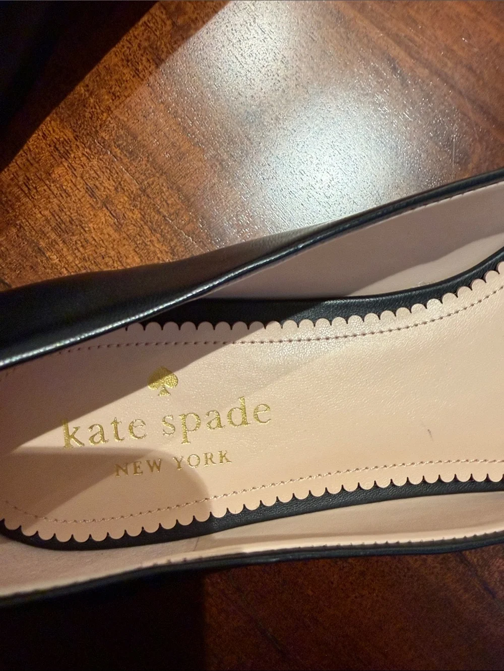 Brand New kate spade Black Pointed-Toe Flats with Silver Heart Accent.